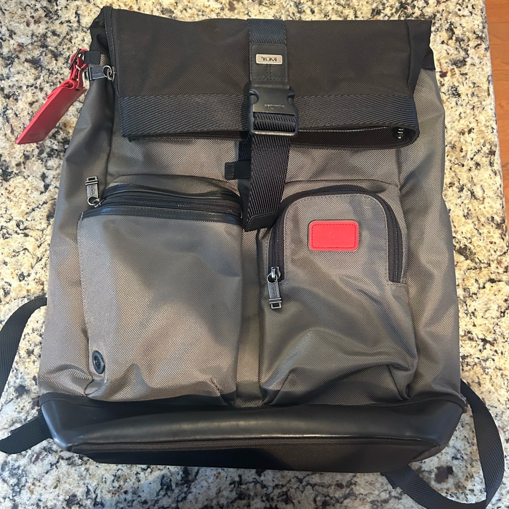 Tumi Gray and Black Cypress Roll-Top Backpack with Red Accent